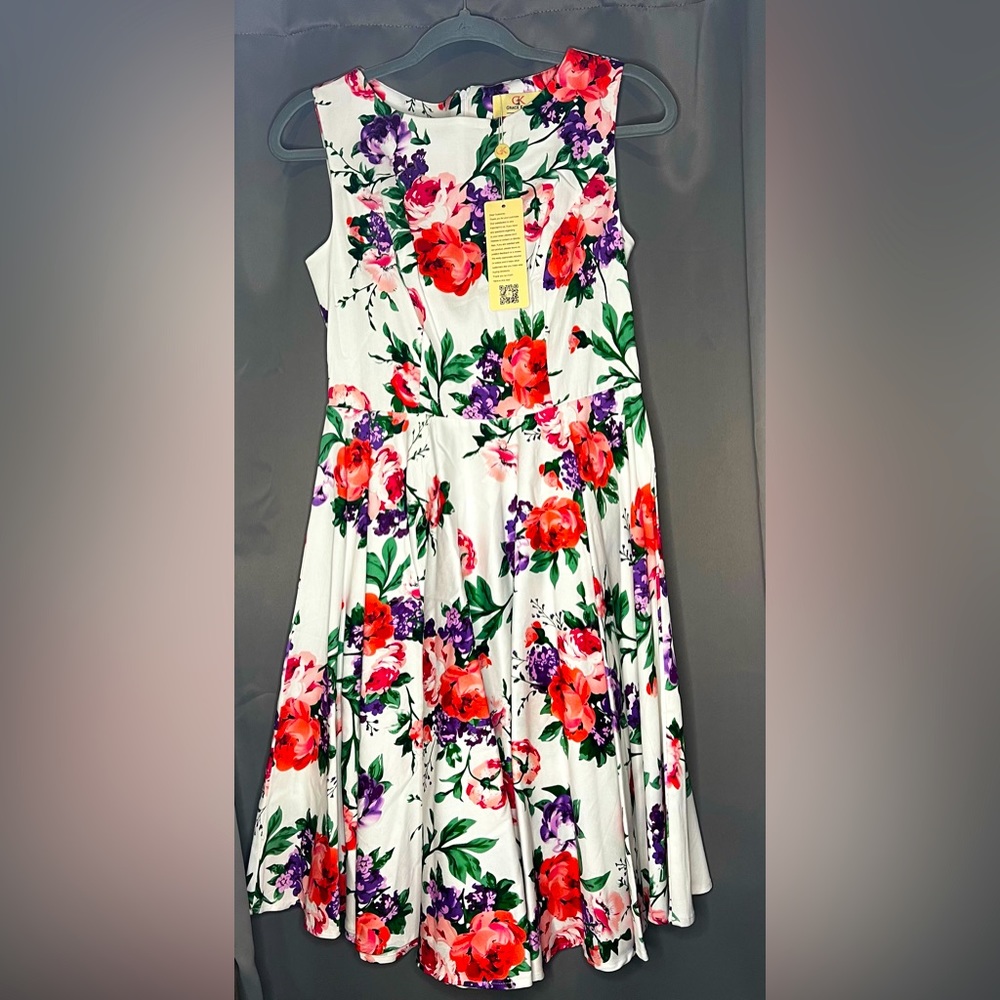 New never been worn before with tags. Colorful floral dress on white background